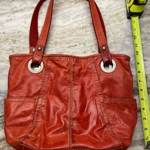 Red vintage leather fossil purse with 2 side pockets